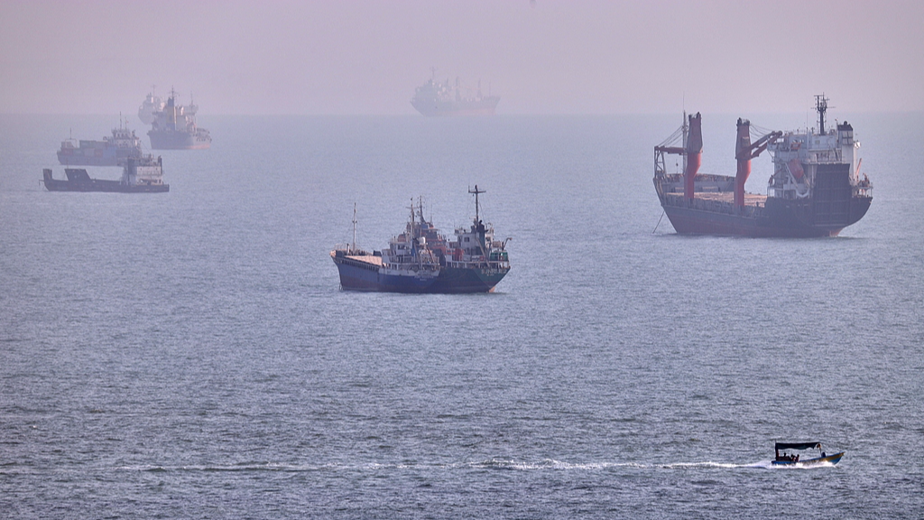 Cargo ships and other commercial vessels anchored in the Strait of Hormuz, August 5, 2026. /VCG
