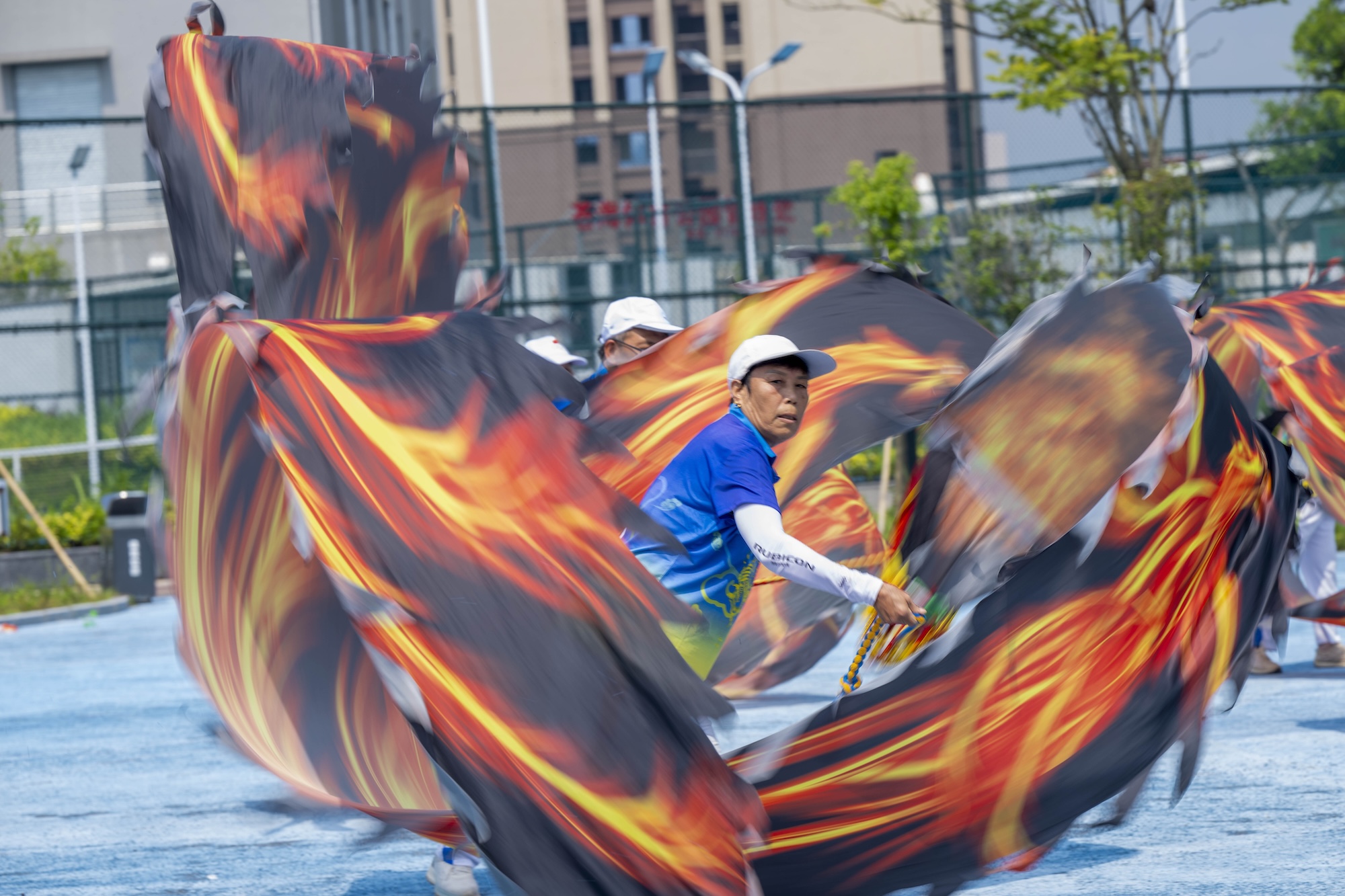Residents perform a ribbon dragon dance to celebrate National Fitness Day at Canghai Sports Park in Wuzhou, south China's Guangxi Zhuang Autonomous Region on August 7, 2026. /IC