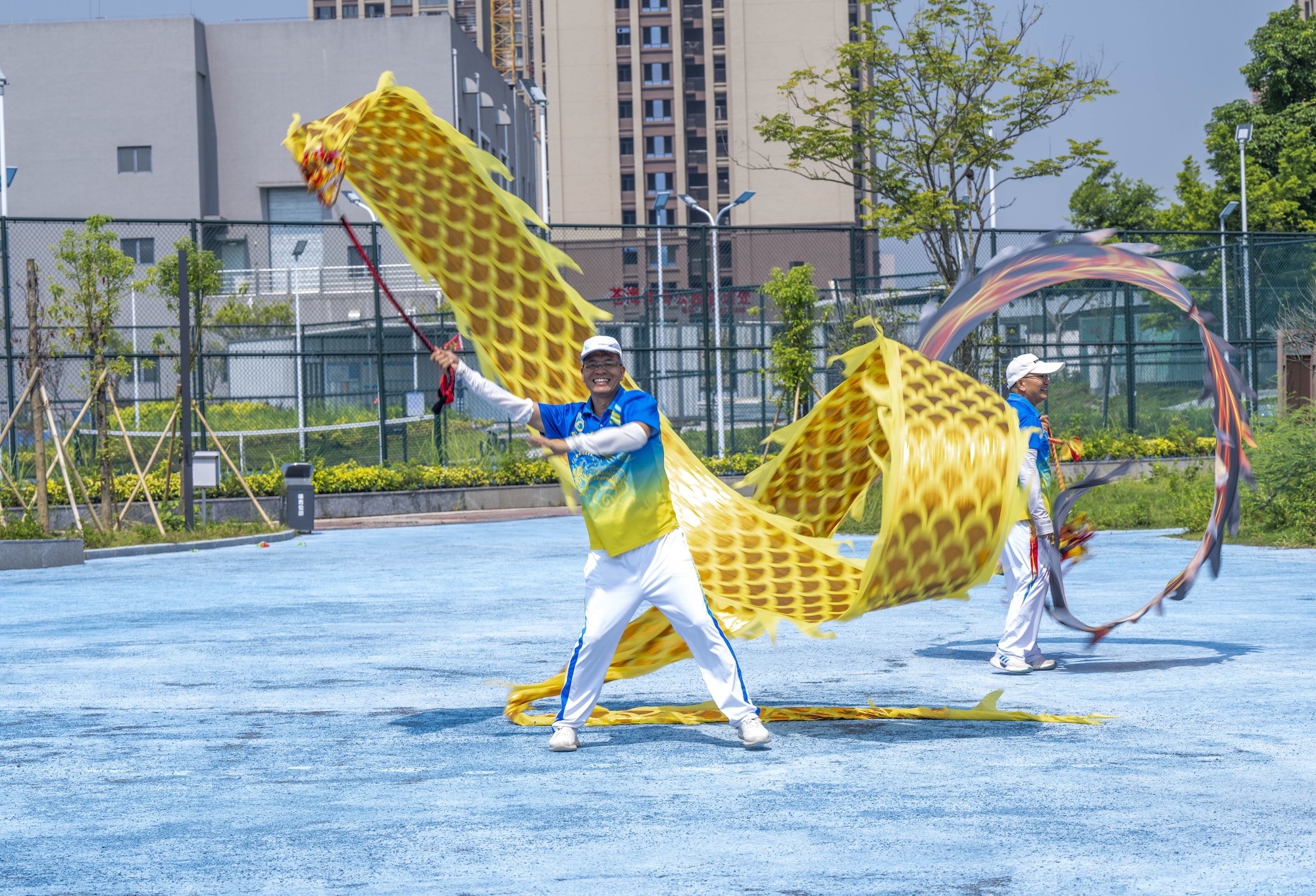 Residents perform a ribbon dragon dance to celebrate National Fitness Day at Canghai Sports Park in Wuzhou, south China's Guangxi Zhuang Autonomous Region on August 7, 2026. /IC