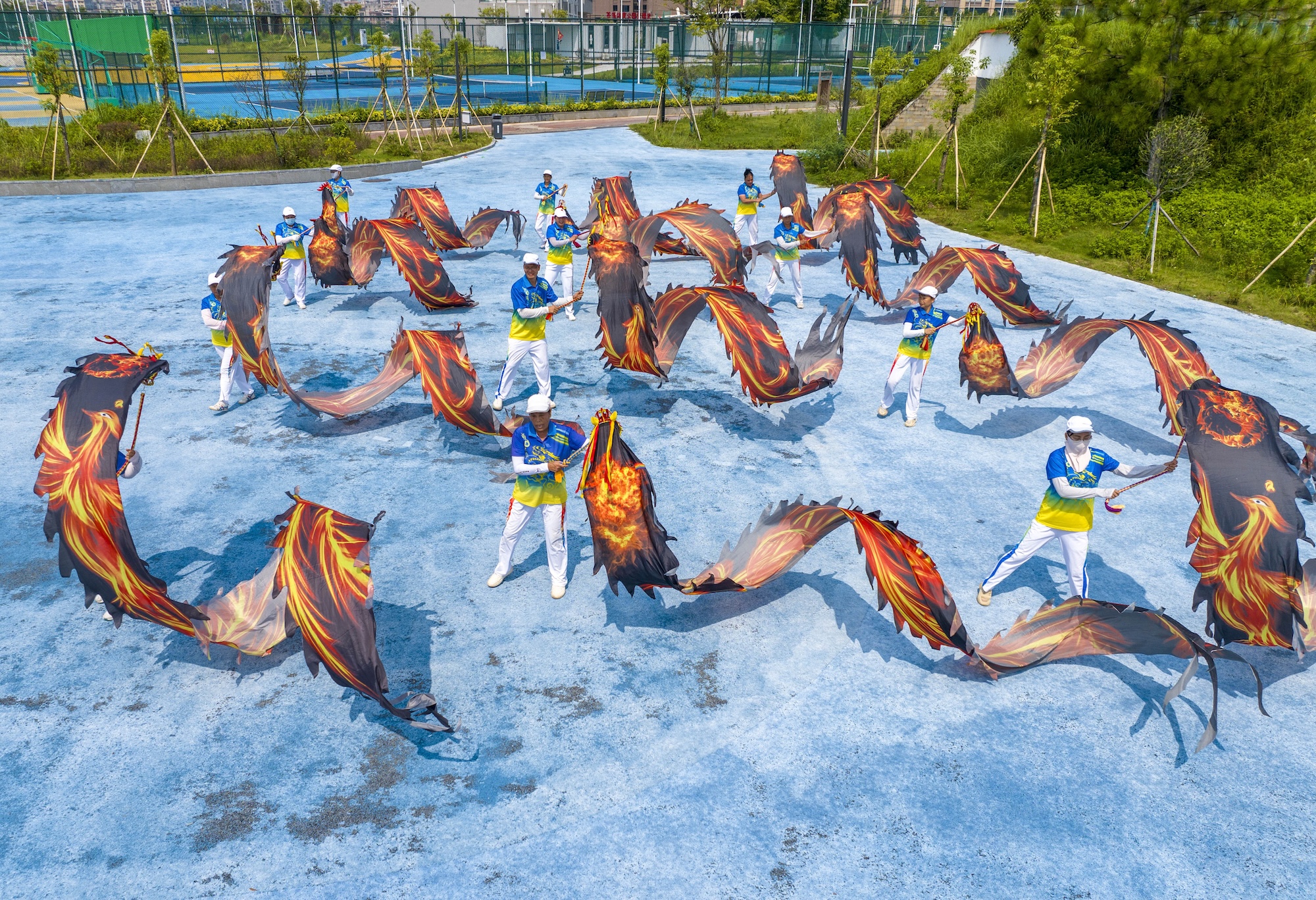 Residents perform a ribbon dragon dance to celebrate National Fitness Day at Canghai Sports Park in Wuzhou, south China's Guangxi Zhuang Autonomous Region on August 7, 2026. /IC