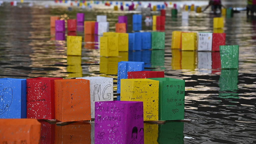 Hundreds of paper lanterns float along the Motoyasu River during the annual lantern floating ceremony marking the 81st anniversary of the atomic bombing of Hiroshima, in Hiroshima, Japan, August 6, 2026. /VCG