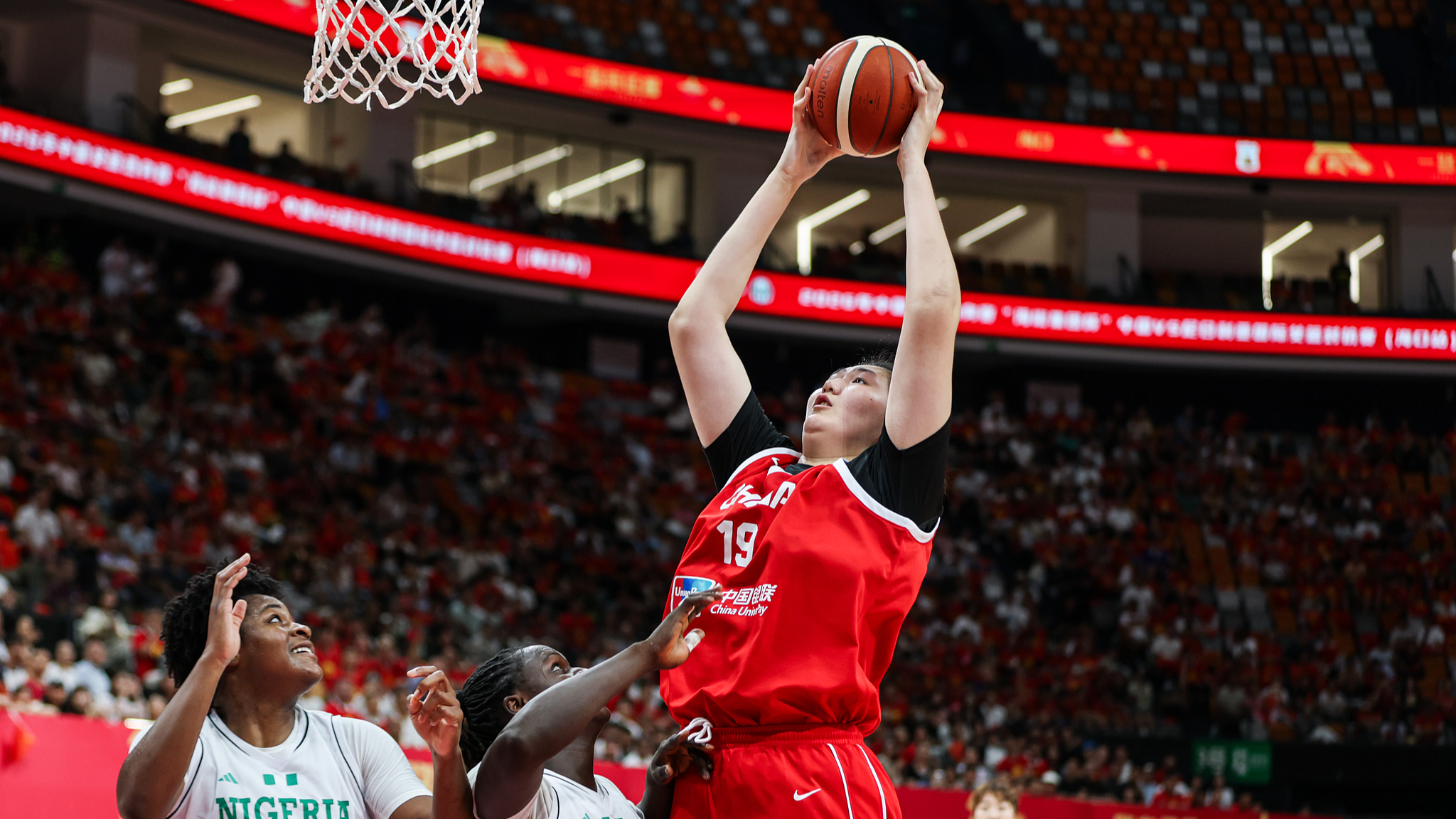 Zhang Ziyu rises for a layup during the FIBA Women's Basketball World Cup warm-up match between China and Nigeria in Haikou, Hainan, China, August 7, 2026. /VCG