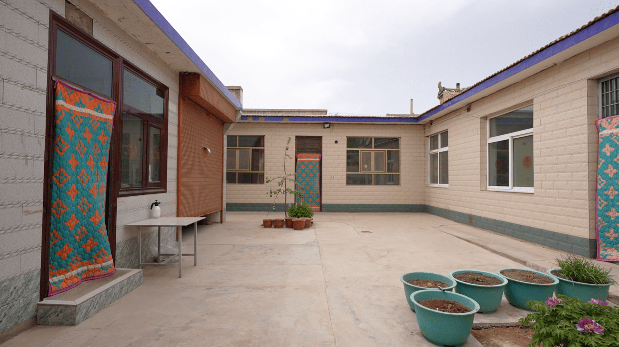 Liu Li's new home in Yuanlong Village, Minning Town. It is the largest resettlement village built for Ningxia's ecological migration program during the 12th Five-Year Plan (2011–2015). Since 2012, about 2,000 households from Guyuan in southern Ningxia have relocated here, closer to the Yellow River and the regional capital, Yinchuan. April 22, 2026. CGTN.