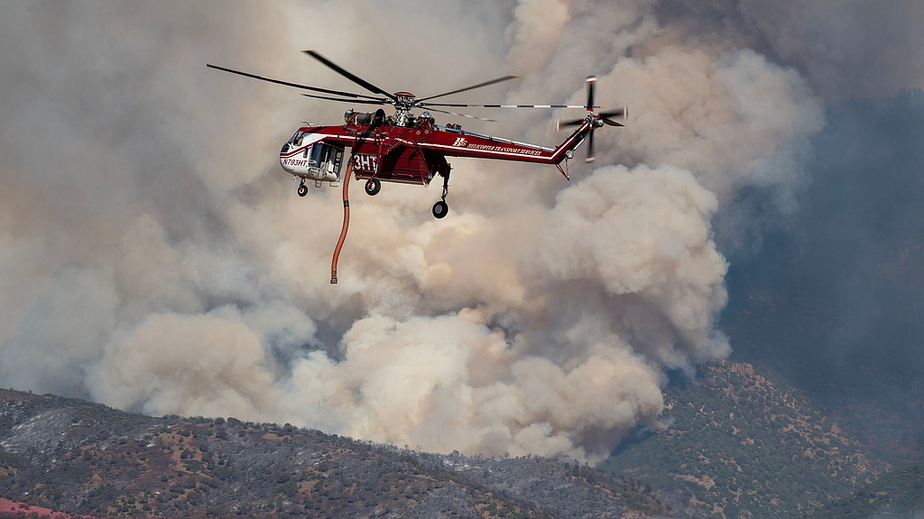 Wildfires spread across North America and Europe, 2 killed in Utah