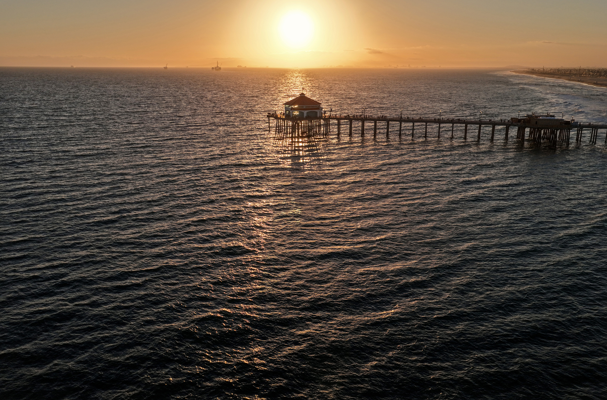 The sun sets over the Pacific Ocean on Huntington Beach, California, the United States, July 1, 2026. /VCG