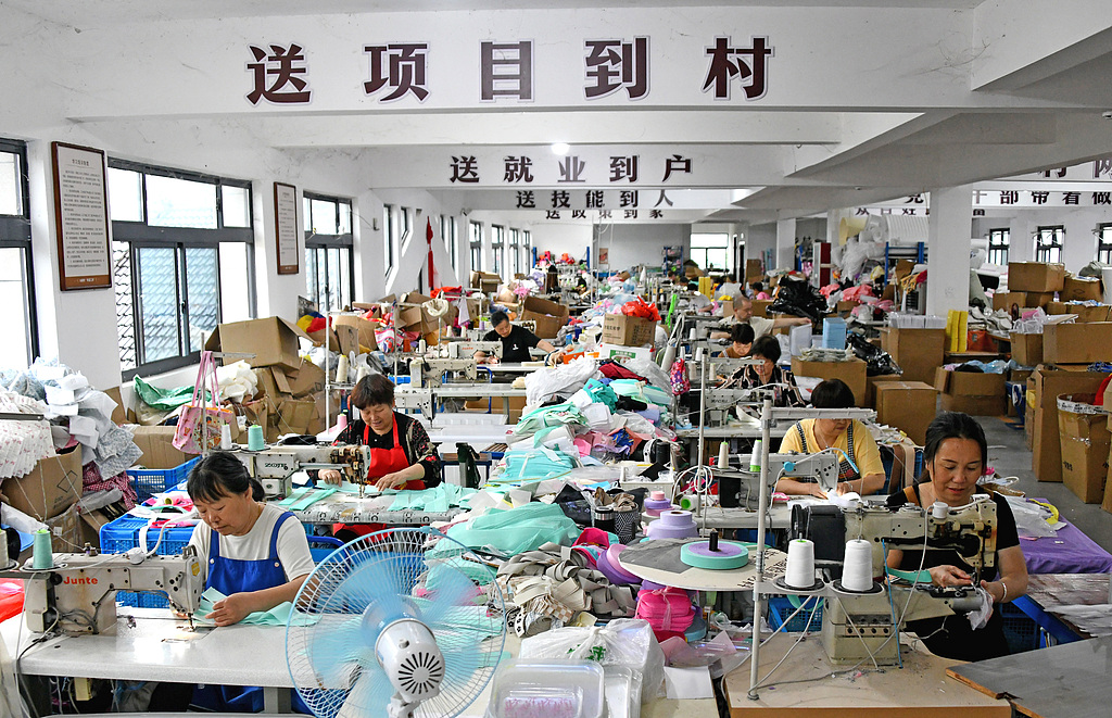 Workers rush to fulfill orders at a 