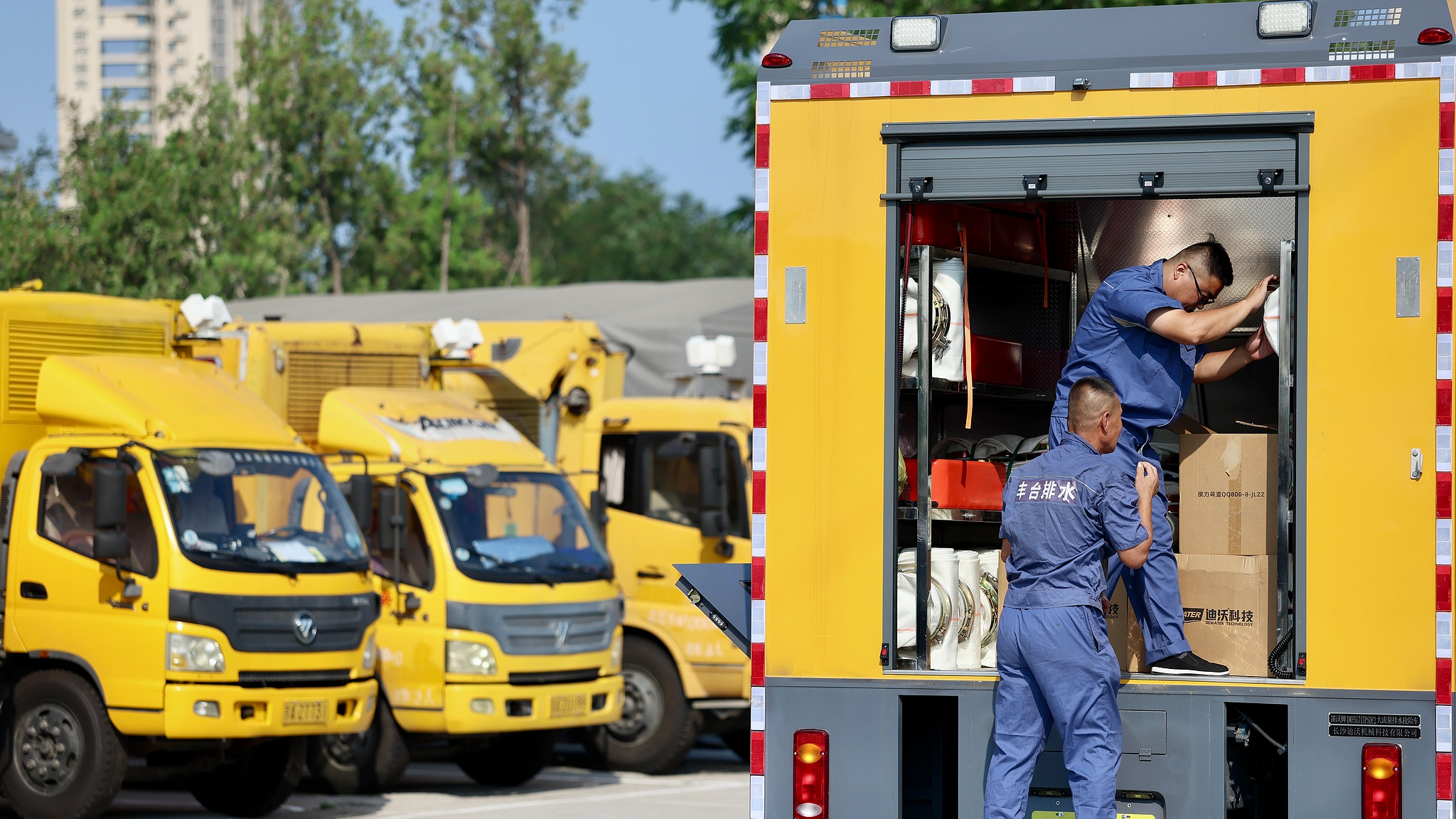 Staff of the Fengtai District Water Authority in Beijing inspect and test drainage and emergency response vehicles ahead of heavy rainfall, August 10, 2026. /VCG