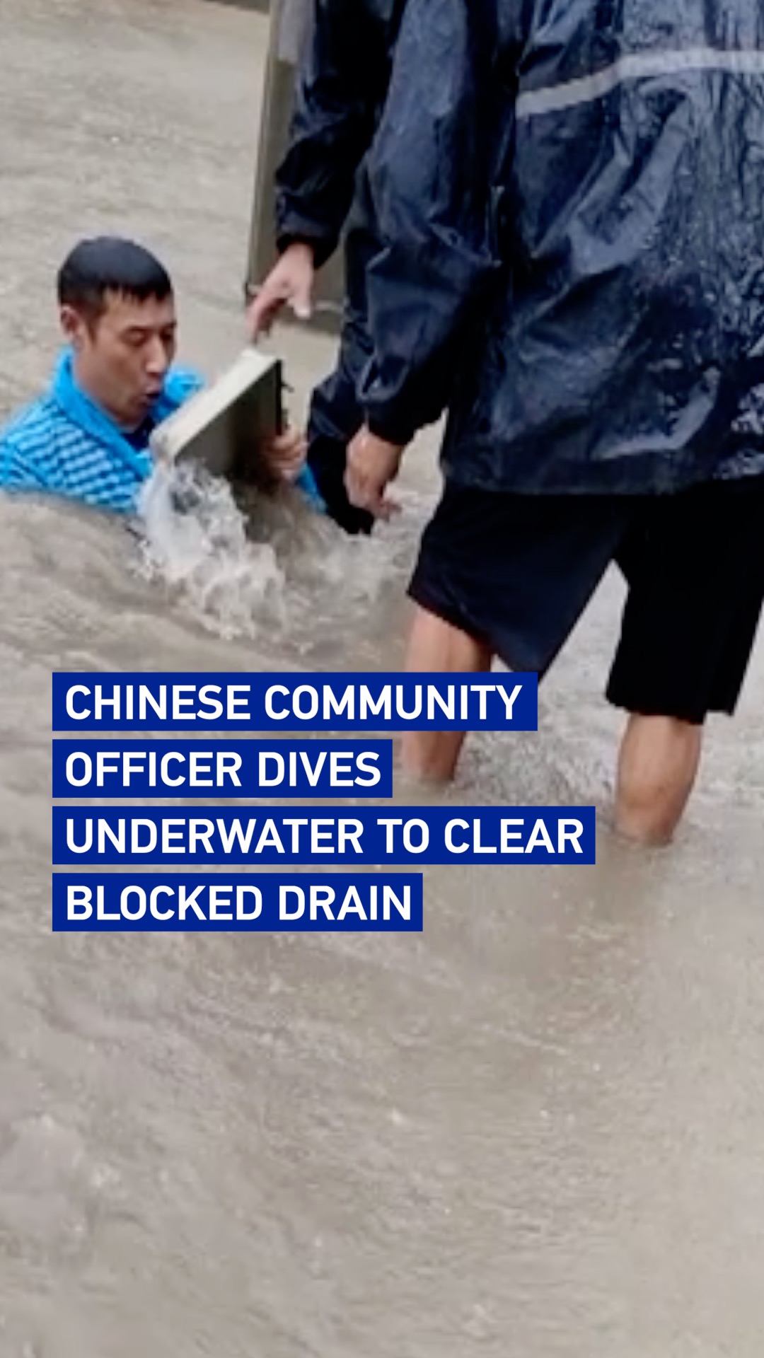 Chinese community officer dives underwater to clear blocked drain 