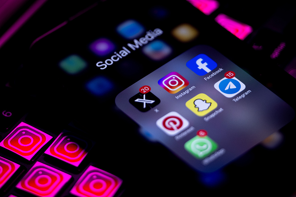 Mobile phone screens display Instagram's logo and a social media folder with X, Instagram, Facebook, Pinterest, Snapchat, Telegram and WhatsApp applications in Ankara, Türkiye on October 1, 2025. /VCG