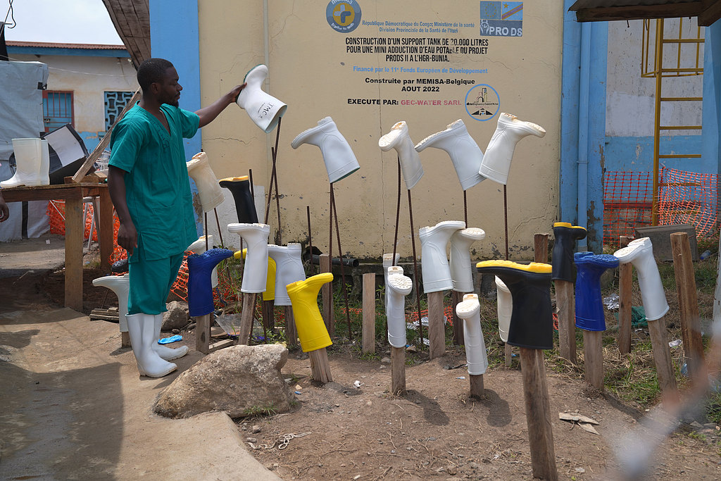 A health worker dries boots that were washed to prevent the spread of the Ebola virus at the treatment center in Bunia General Hospital in Ituri, eastern Democratic Republic of the Congo, August 11, 2026. /VCG