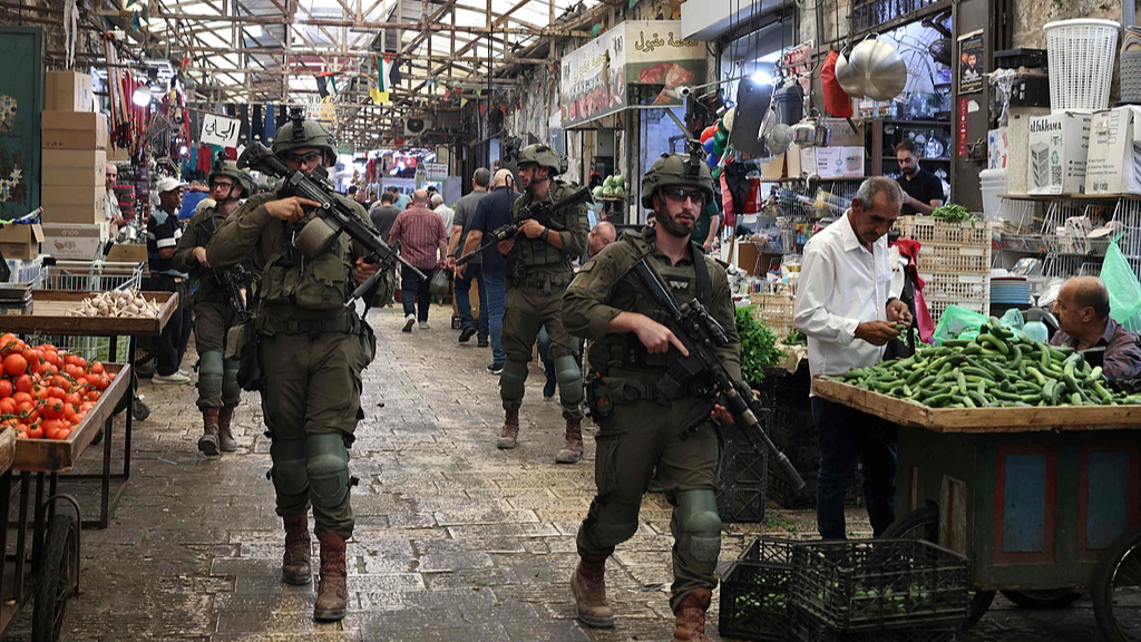 Armed Israeli soldiers carry out a foot patrol through the market, in the Old City of Nablus, in the northern Israeli-occupied West Bank, August 9, 2026. /VCG