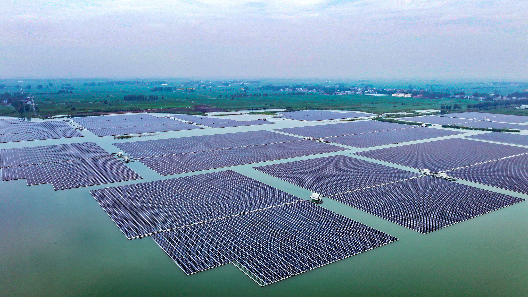 A floating photovoltaic power project on the water surface in Huaibei, east China's Anhui Province, is seen in a full view showing the whole installation. /VCG