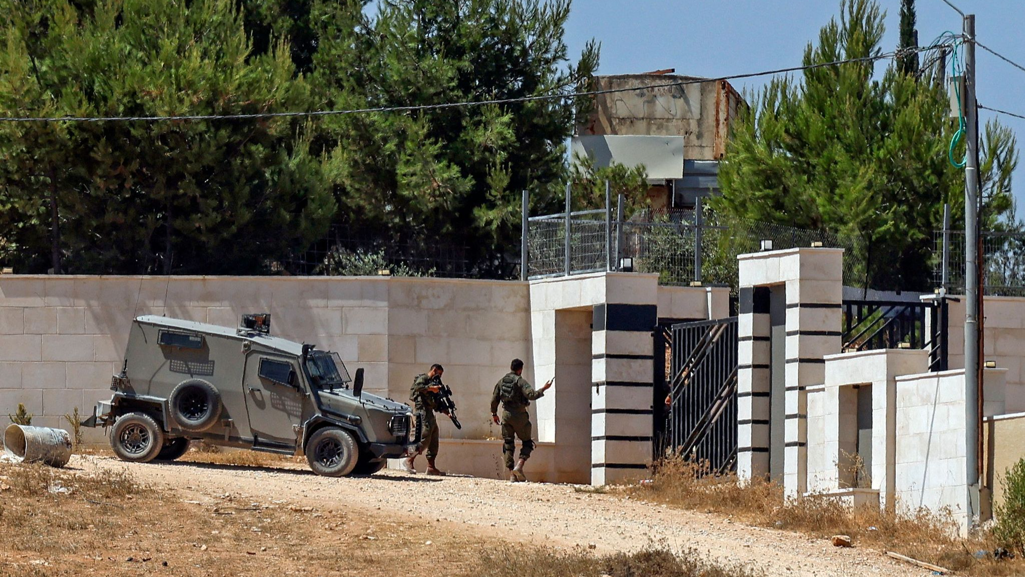 Israel sends troops into West Bank homes besieged by Jewish settlers