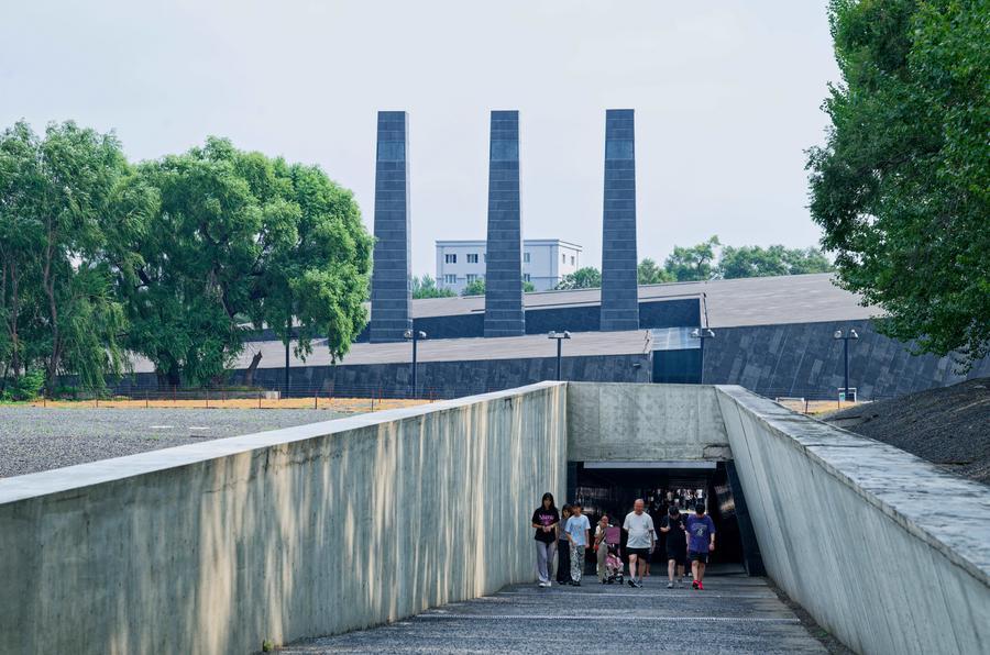 People walk out of the Exhibition Hall of Evidences of Crime Committed by Unit 731 of the Japanese Imperial Army in Pingfang District of Harbin, northeast China's Heilongjiang Province, August 4, 2026. /Xinhua