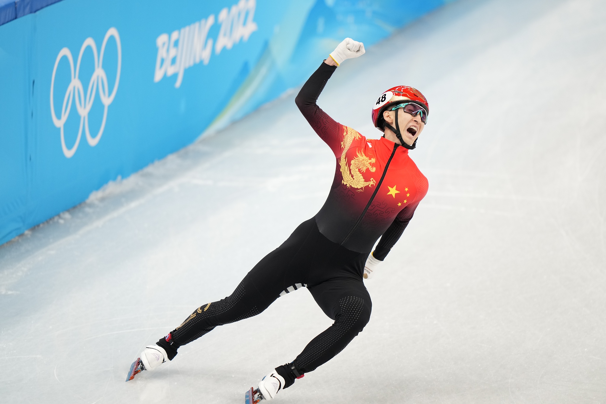 Wu Dajing celebrates after helping China win the short track speed skating mixed team relay Final A during the 2022 Beijing Winter Olympics at Capital Indoor Stadium in Beijing, China, February 5, 2022. /VCG