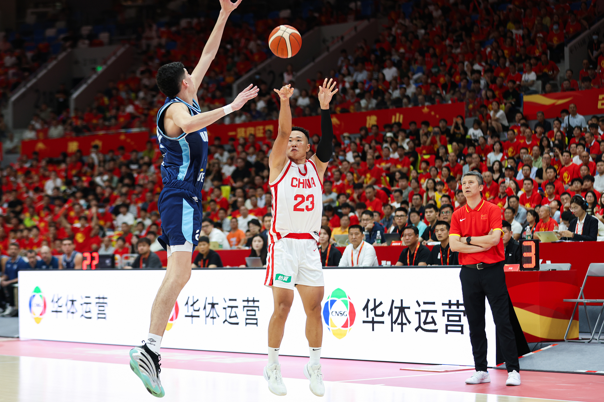 China's He Xining (#23) shoots in the warm-up game against Uruguay in Foshan, south China's Guangdong Province, August 13, 2026. /VCG