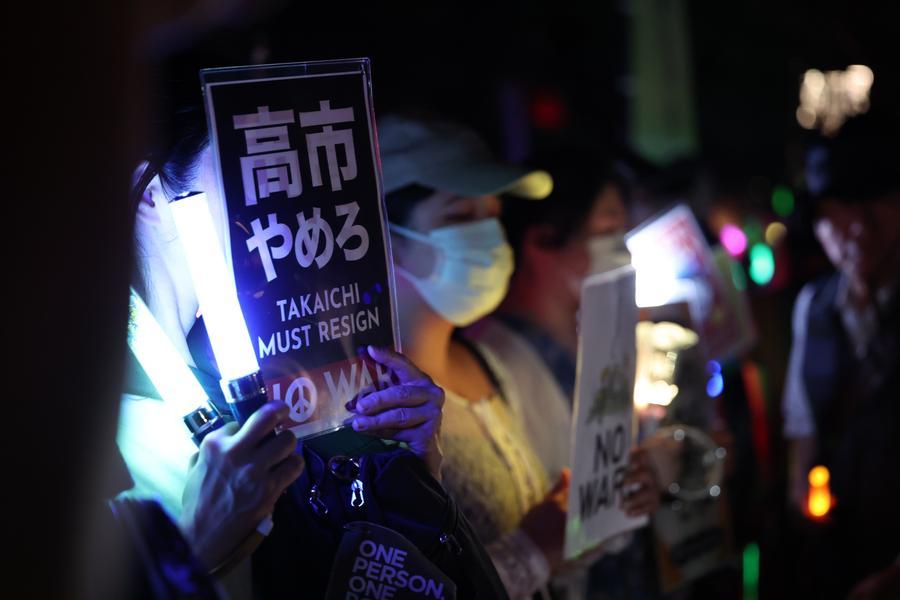 People holding signs attend an anti-war protest rally in front of the National Diet Building in Tokyo, Japan, July 10, 2026. /Xinhua