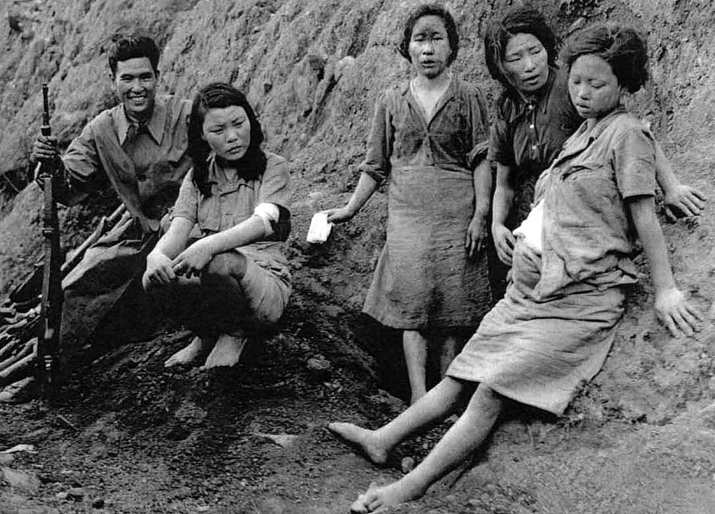 The pregnant woman in the photo is Pak Yong-sim, a Korean woman who was deceived into becoming a 