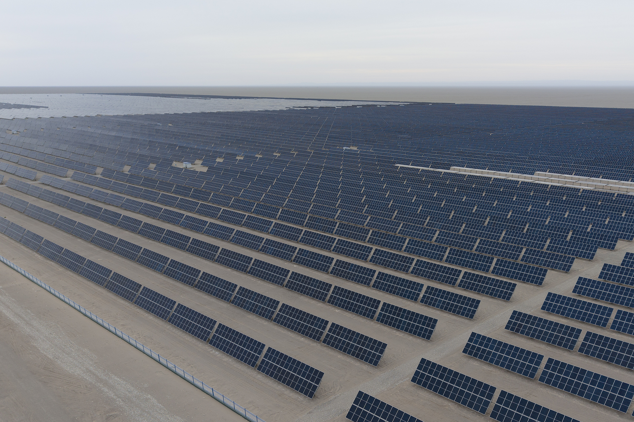 Aerial view of the solar modules of the 100-megawatt photovoltaic on-grid power project at Dunhuang Photovoltaic Industrial Park in Dunhuang, northwest China's Gansu Province, May 31, 2026. /CFP