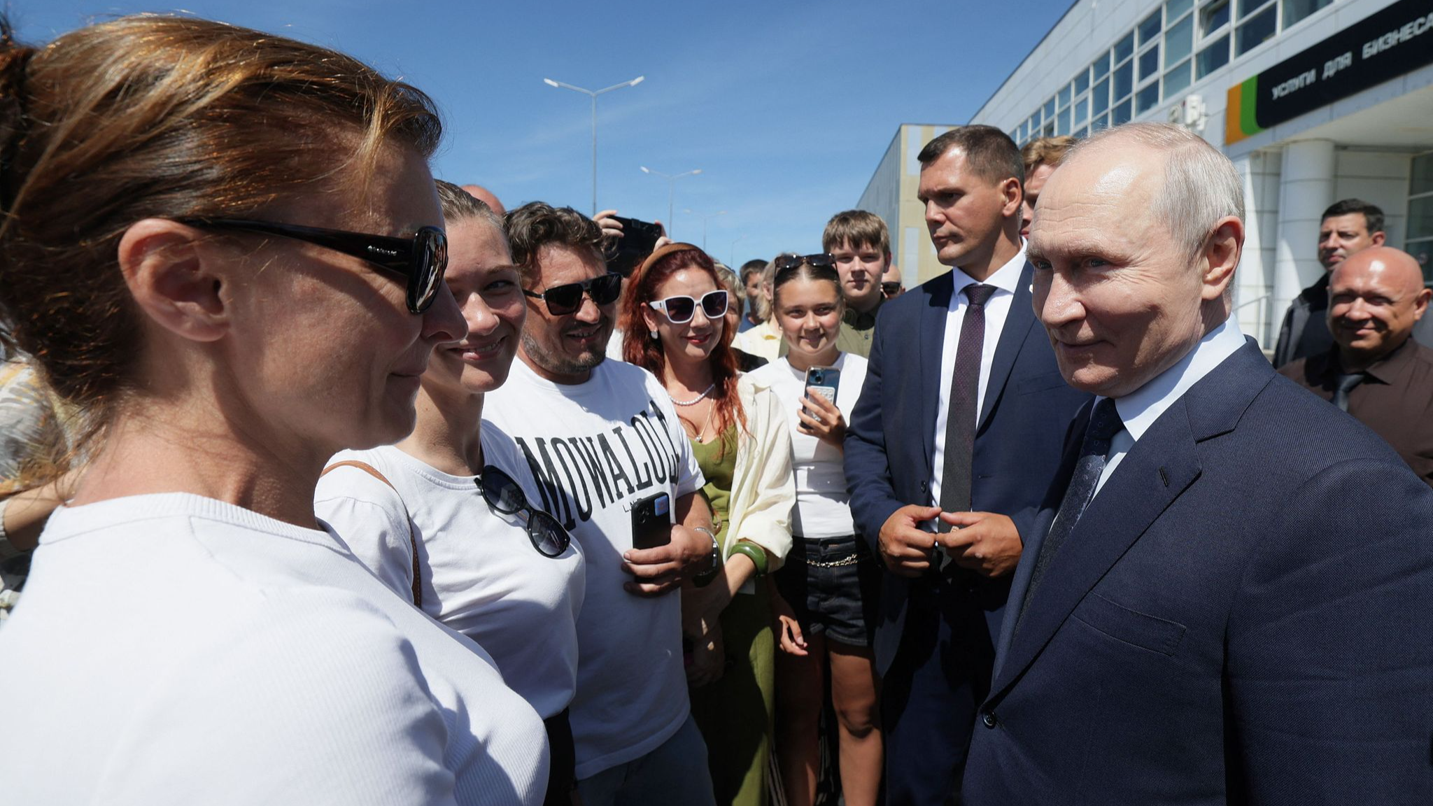Russian President Vladimir Putin speaks with locals on Iturup island, one of four islands in the contested chain known as the Kuril Islands in Russia and the Northern Territories in Japan, on August 13, 2026. /VCG