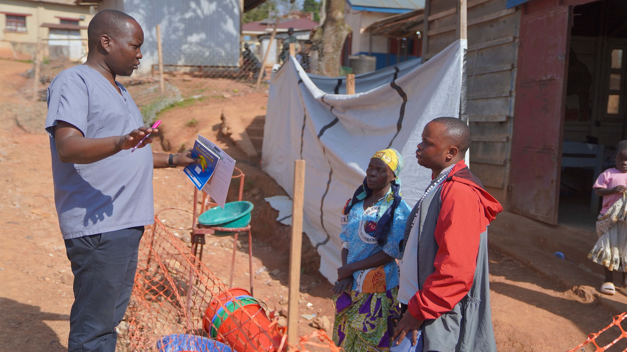 Gédéon Banga Ngbape (L), an Ebola surveillance officer, does contact tracing in Nizi, Ituri Province, the Democratic Republic of the Congo, August 14, 2026. /CFP
