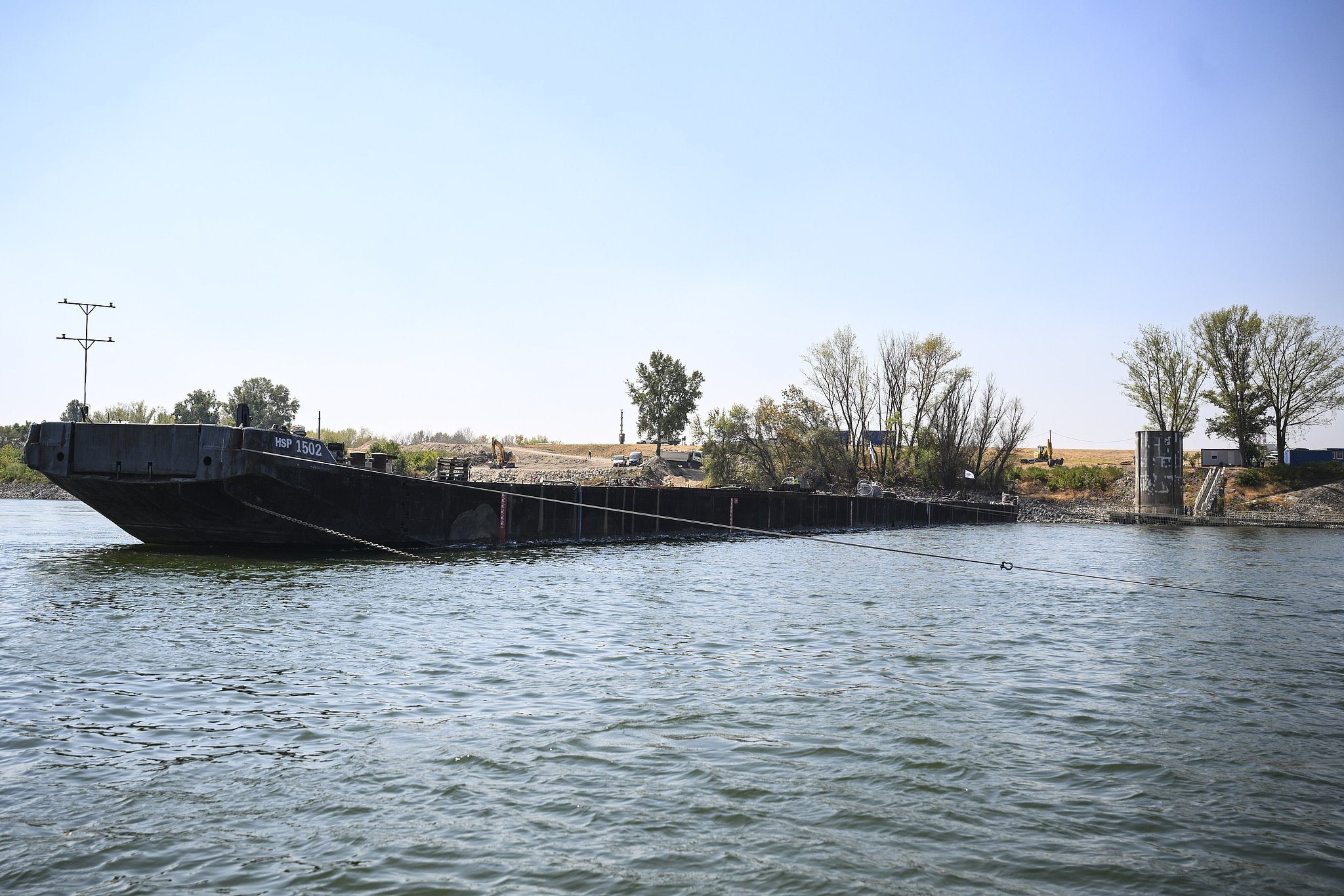 A barge is seen on the Danube near the MVM Paks nuclear power plant, Hungary, August 15, 2026. /VCG