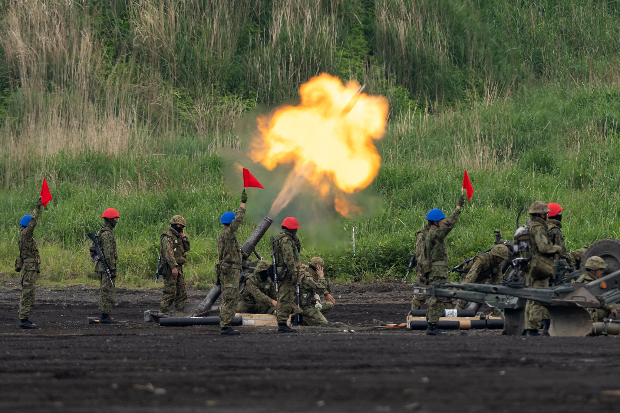 Members of the Japan Ground Self-Defense Force fire a mortar during a live-fire exercise in the East Fuji Maneuver Area in Gotemba, Shizuoka Prefecture, Japan, June 8, 2025. /CFP
