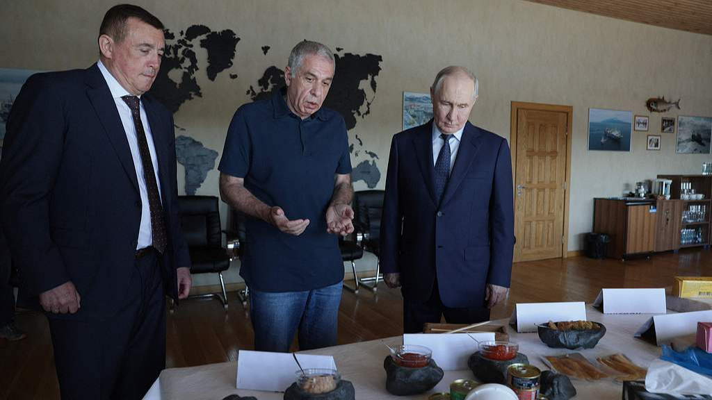 Russian President Vladimir Putin visits the Yasny fish processing factory on Iturup island, one of four islands in the contested chain known as the Kuril Islands in Russia and the Northern Territories in Japan, August 13, 2026. /VCG