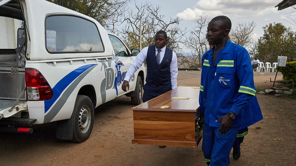A coffin with the body of a victim of the capsized passenger ferry leaves the Kariba Hospital in Kariba, Zimbabwe, August 14, 2026. /VCG