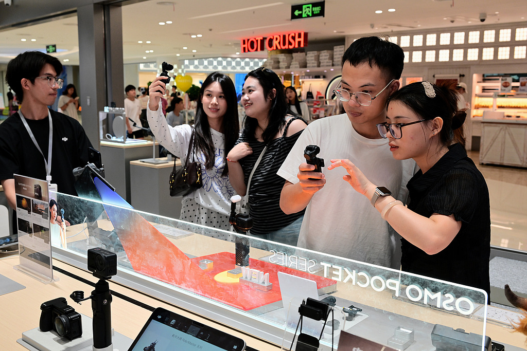 People purchase action cameras at a specialty store in Jinhua, east China's Zhejiang Province, August 15, 2026. /VCG