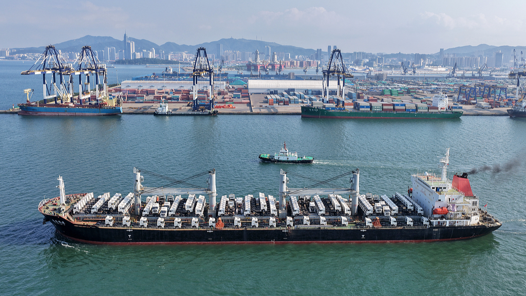 A cargo ship fully loaded with trucks departs from Yantai Port in Yantai, east China's Shandong Province, July 20, 2026. /VCG