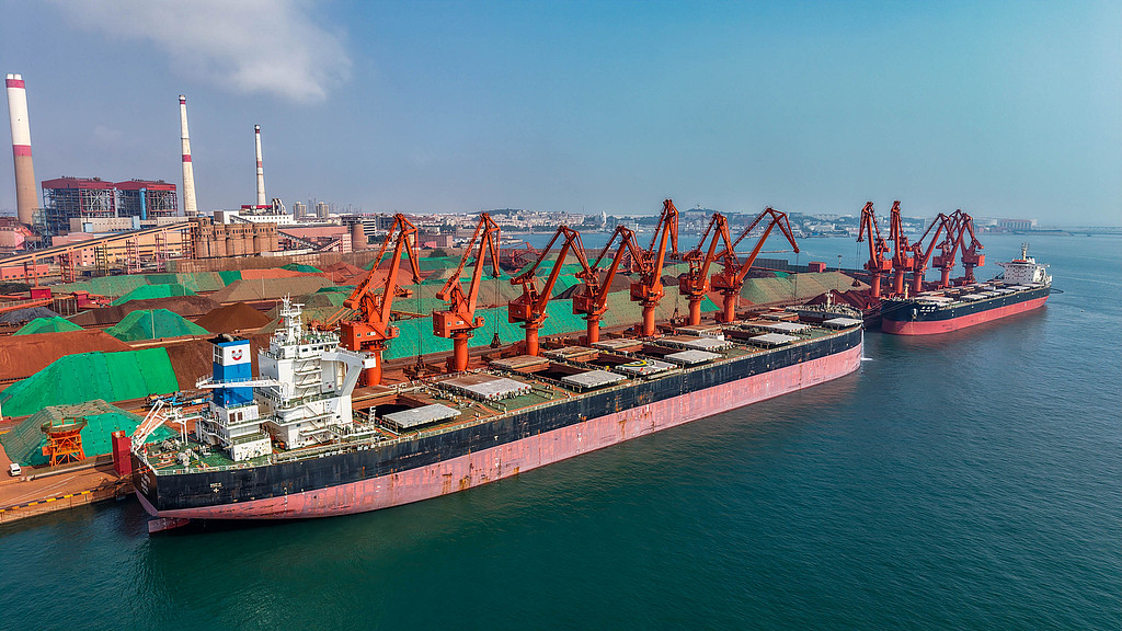 Cargo ships unload imported iron ore at Qingdao Port, Qingdao, Shandong Province, China, August 17, 2026. /VCG