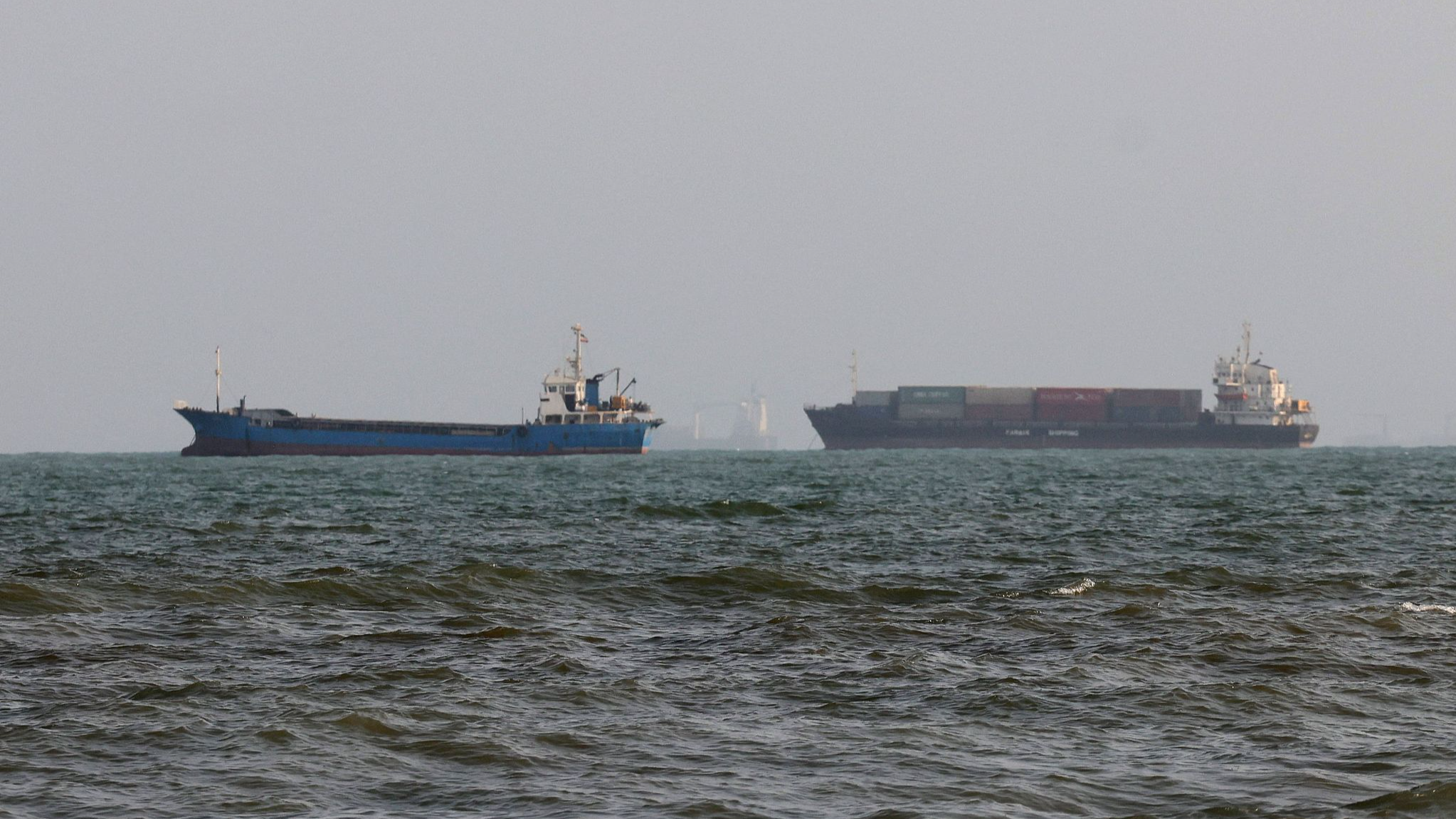 Vessels are seen in the Strait of Hormuz, off the port city of Bandar Abbas in southern Iran, August 10, 2026. /VCG