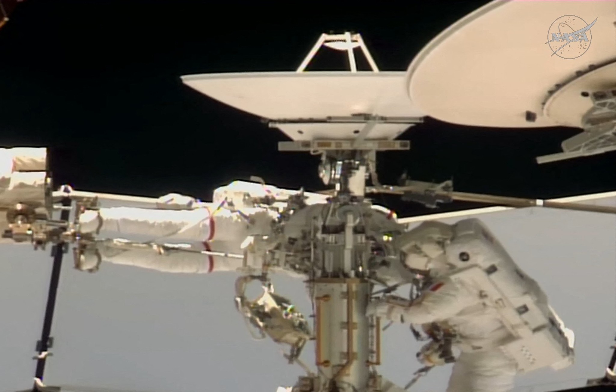NASA astronaut Anil Menon (L) and European Space Agency astronaut Sophie Adenot (R) work outside the International Space Station during a spacewalk to replace a space-to-ground antenna, according to NASA, August 18, 2026. /VCG