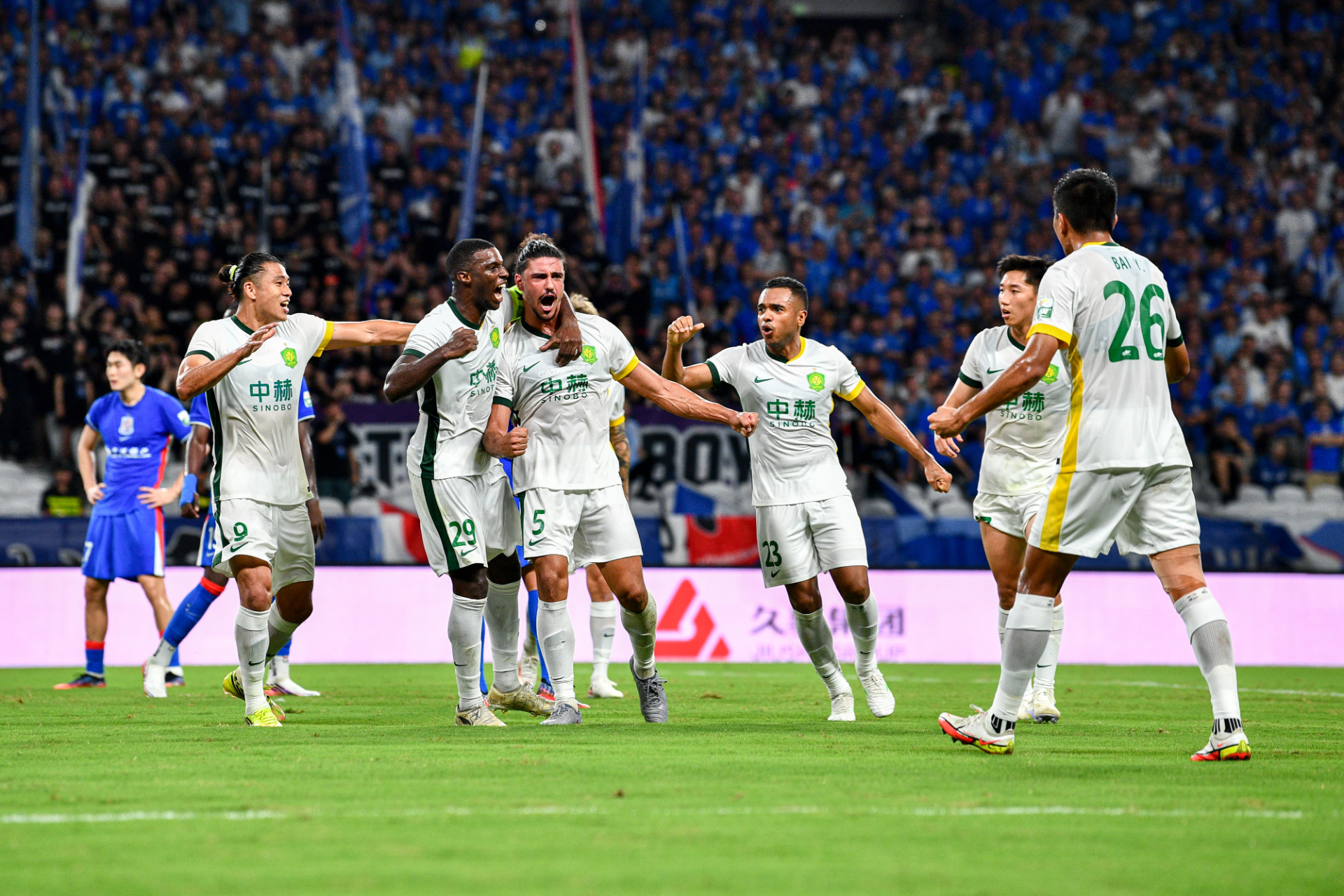 Beijing Guoan's players celebrate after scoring a goal against Shanghai Shenhua in a Chinese Super League match in east China's Shanghai Municipality, August 18, 2026. /IC Photo