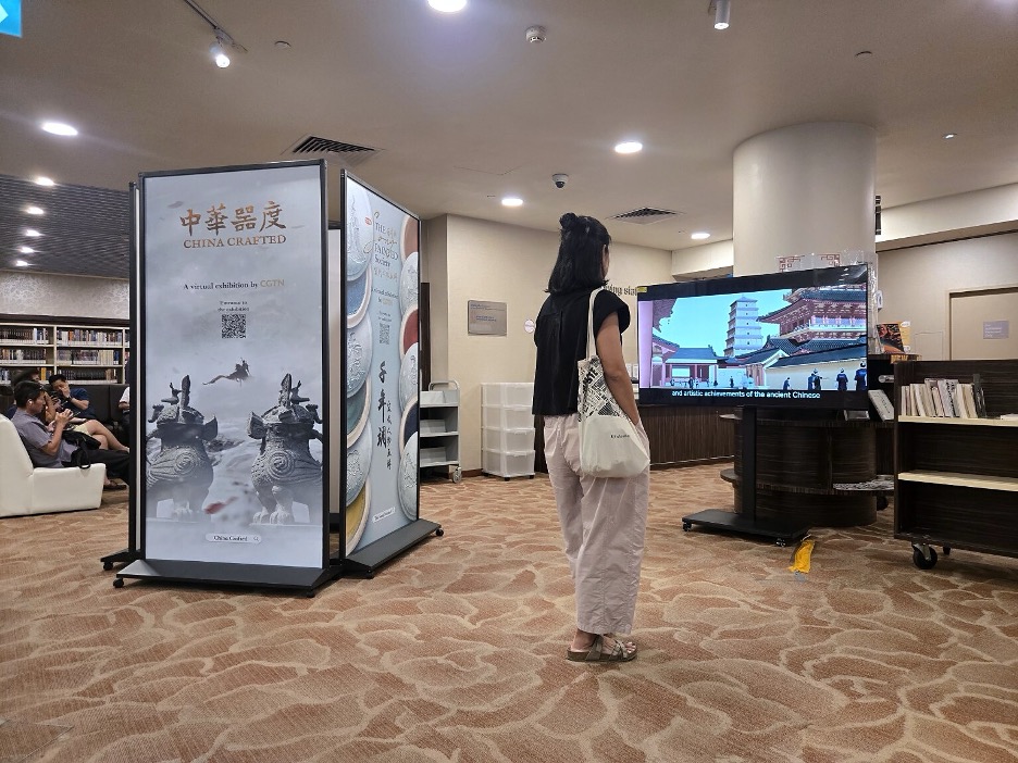 A visitor watches an animated sequence at the China Crafted showcase. /CGTN