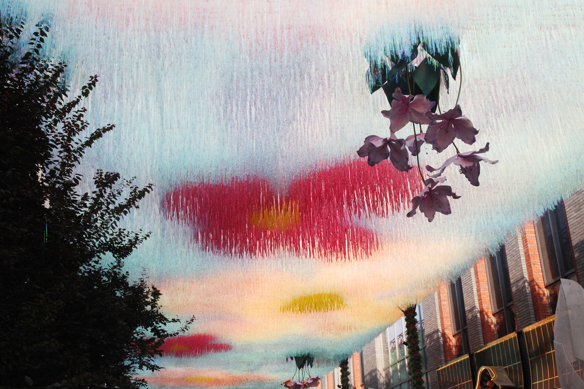 A view of the flower-themed art canopy over Langfang Toutiao Hutong in Beijing's historic Qianmen area. /CGTN