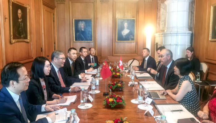 Swiss Federal President Guy Parmelin and Chinese Commerce Minister Wang Wentao meet with their respective delegations in Bern, Switzerland, August 20, 2026. /Chinese Ministry of Commerce