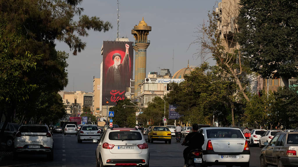 A billboard bearing a message in Farsi that reads 