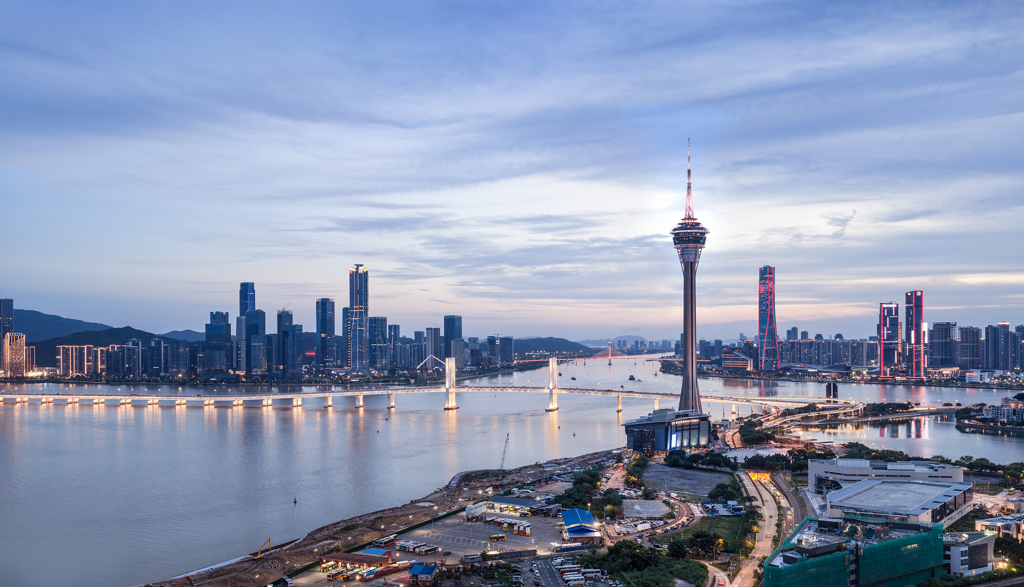 A photo of Hengqin New Area, the Sai Van Bridge and the Macao Tower at dusk in South China, July 9, 2026. /CFP