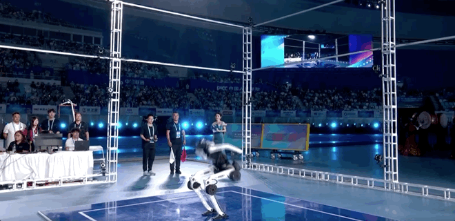 A humanoid robot performs a high jump. /CMG