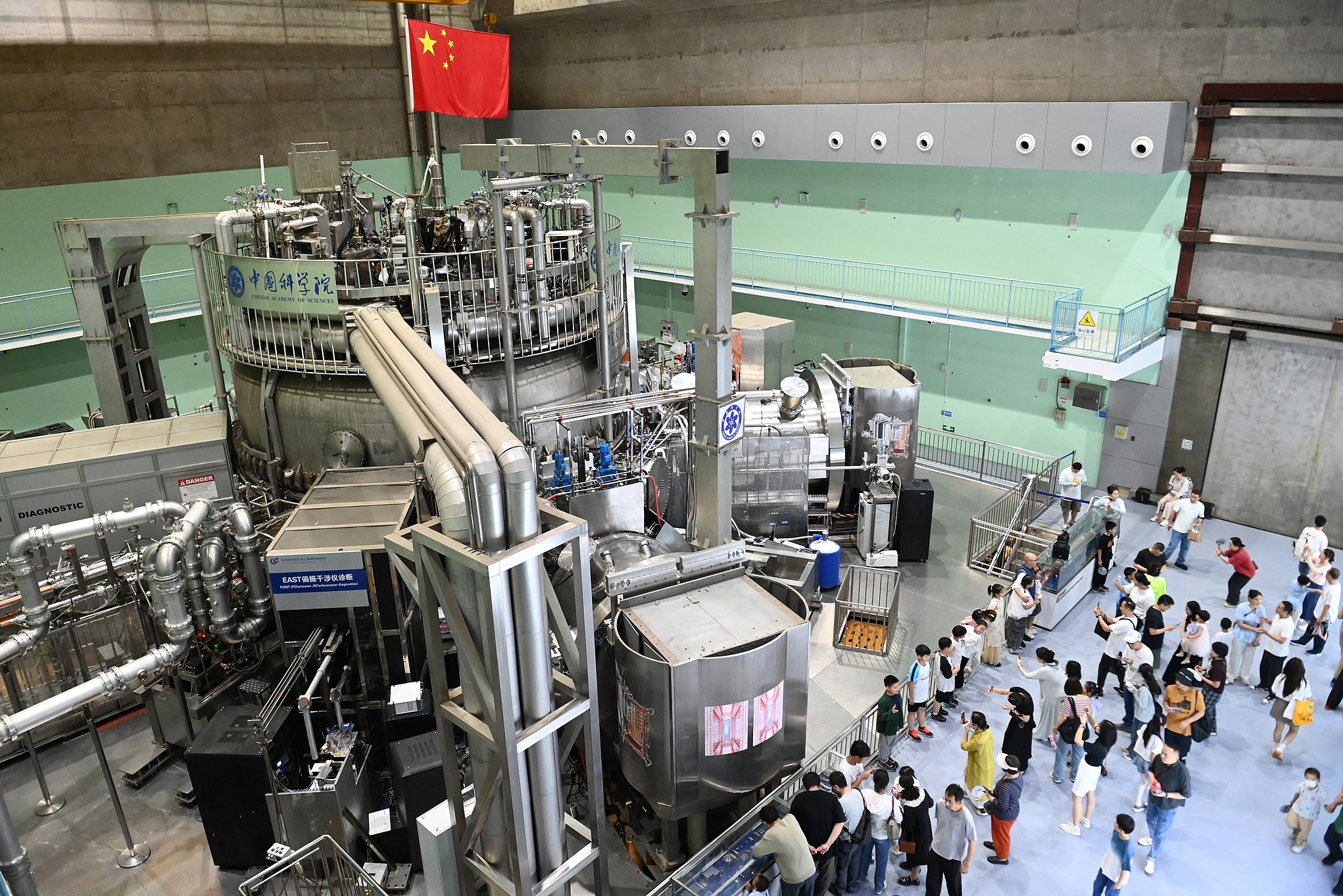 Citizens visit the Experimental Advanced Superconducting Tokamak (EAST) nuclear fusion device, Hefei, east China's Anhui Province, May 17, 2025. /VCG