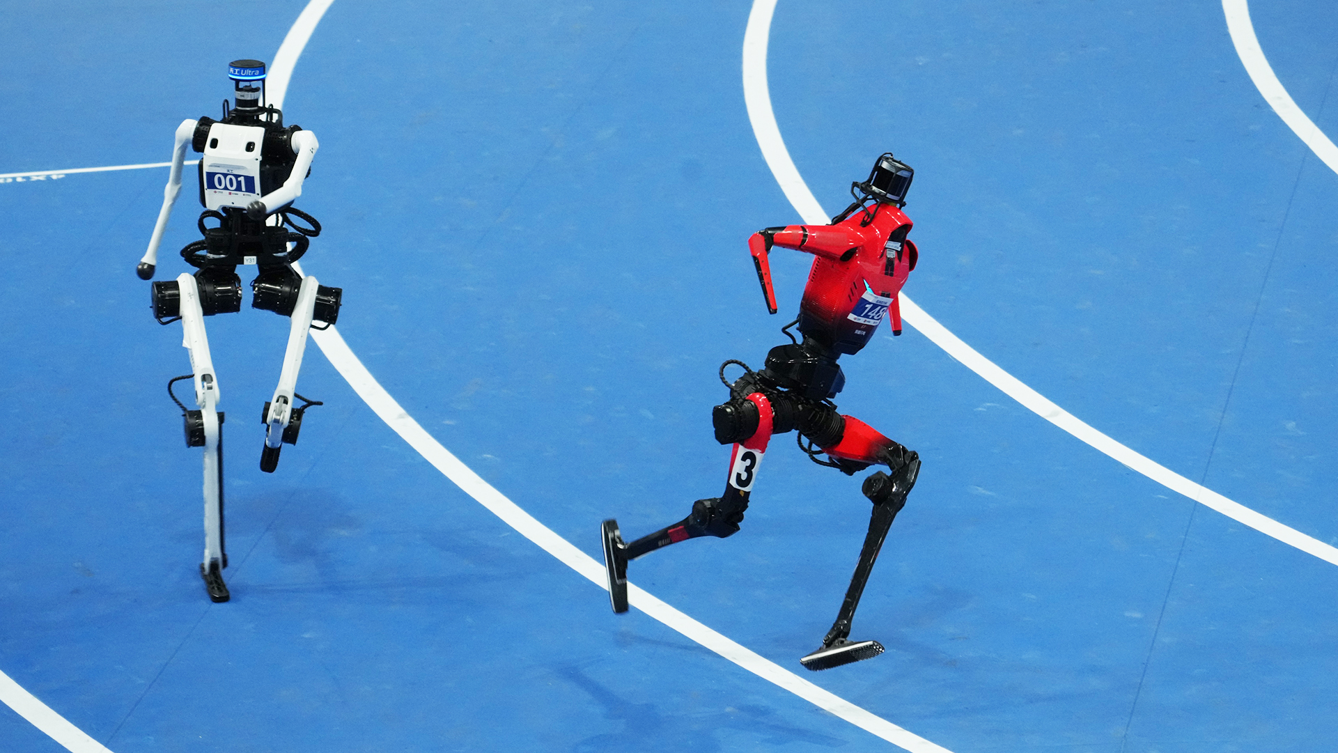 Running competition at the second World Humanoid Robot Games.  / Photo by Qu Bo