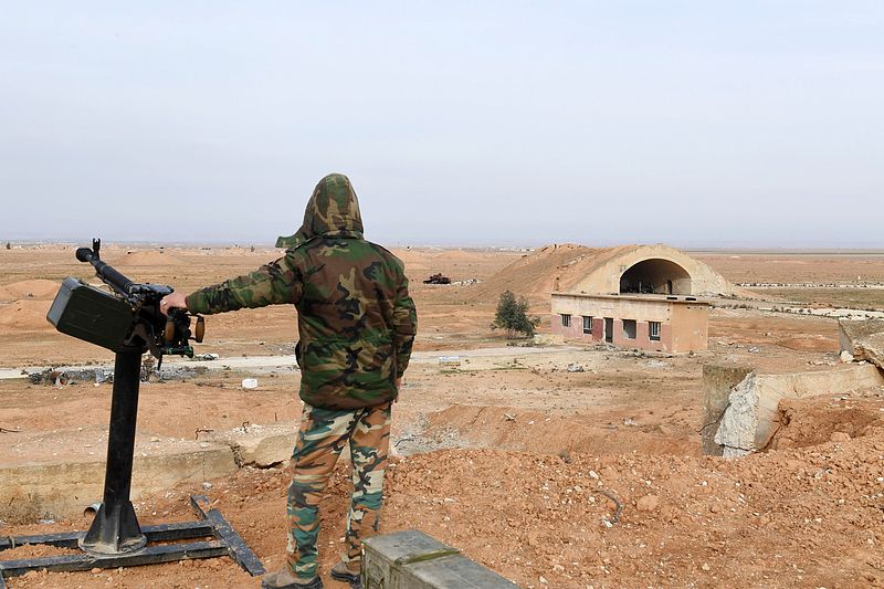 File photo of a member of Syrian government forces standing guard at the Abu al-Duhur military airport in Idlib Province, northwestern Syria, January 21, 2018. /VCG