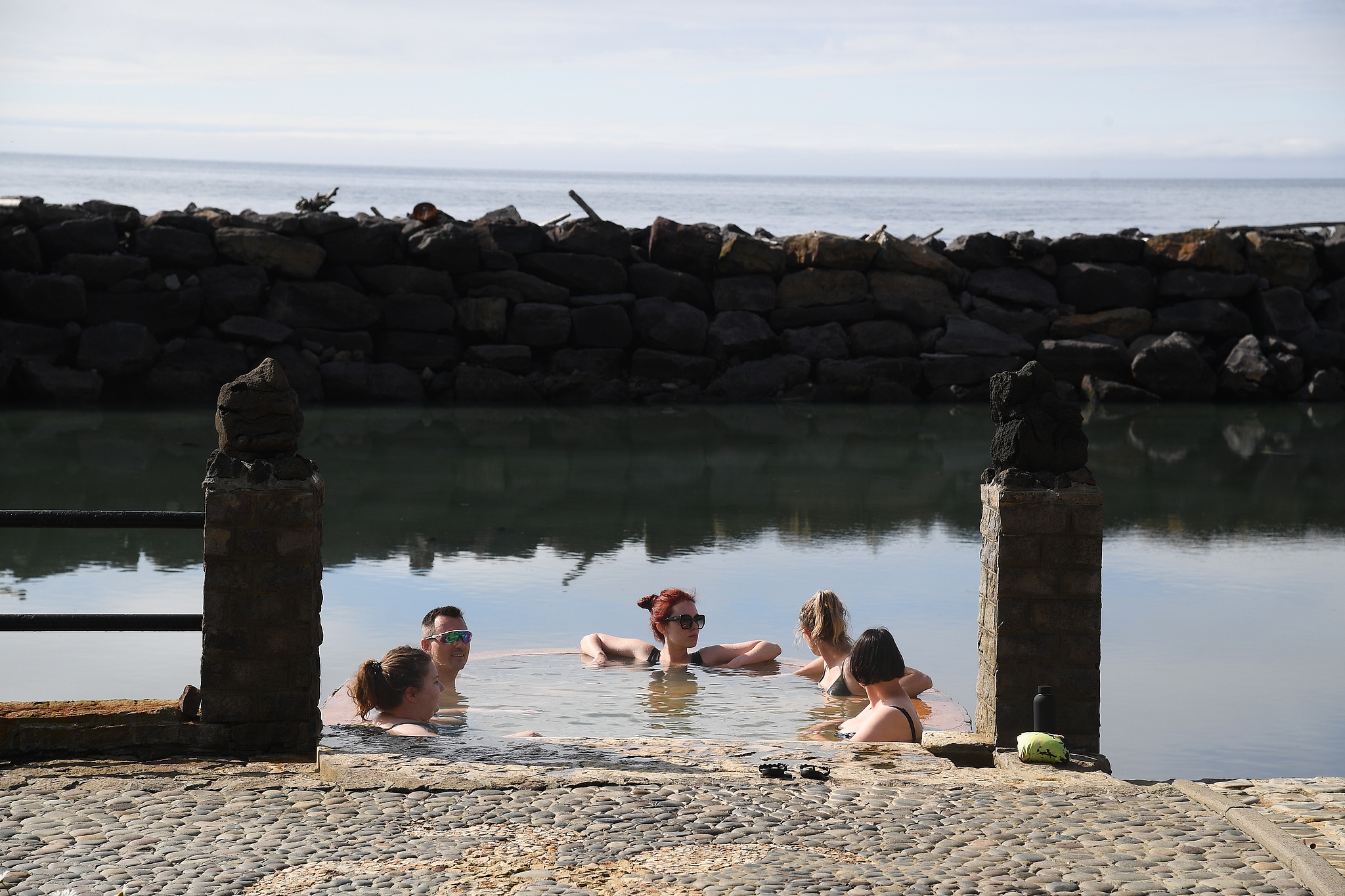 People enjoy a hot spring on Iturup Island, one of the Southern Kuril Islands, July 18, 2023. /CFP