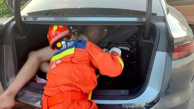Bizarre rescue after man locks himself in his own trunk