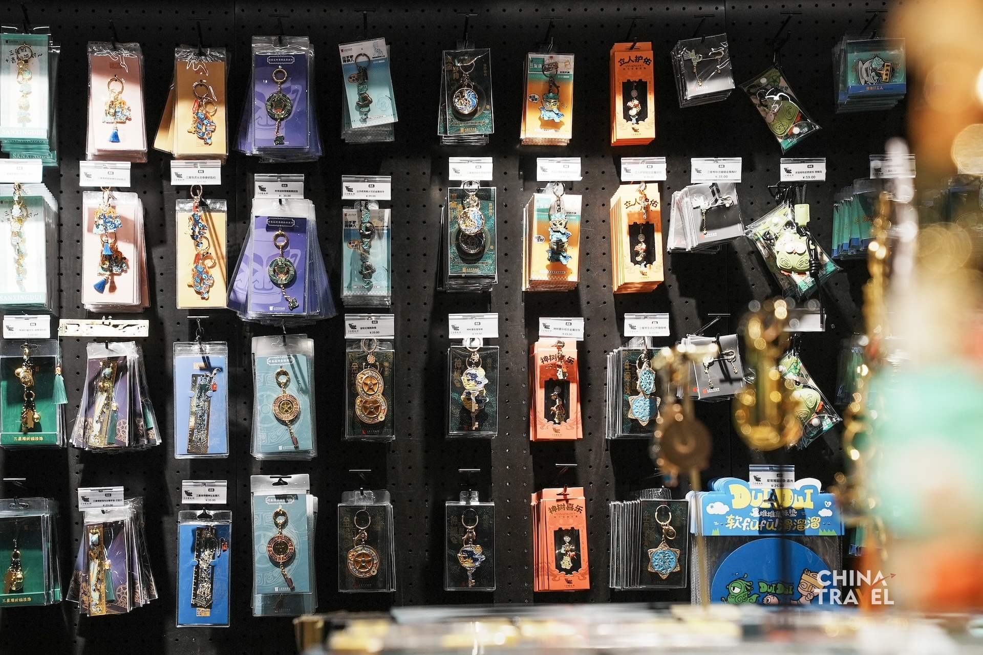 Cultural and creative products inspired by Sanxingdui artifacts bring the museum's iconic bronze figures and masks into everyday life. /CGTN