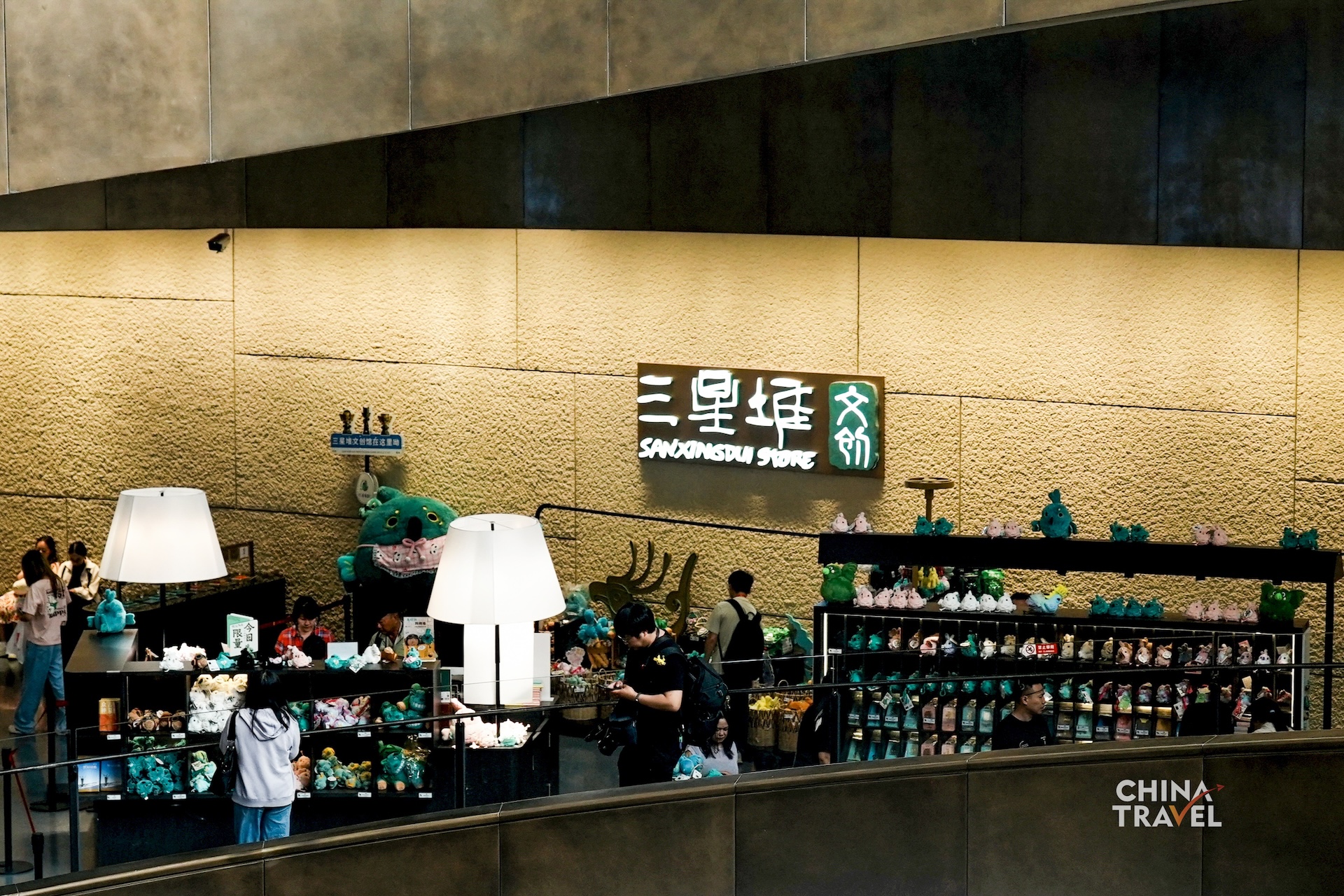 Cultural and creative products inspired by Sanxingdui artifacts bring the museum's iconic bronze figures and masks into everyday life. /CGTN