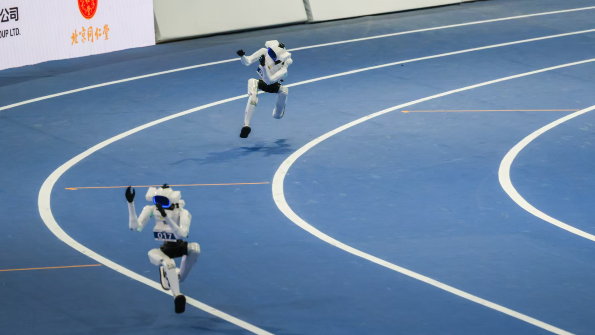 Tiangong Omni robot runs on the athletics track during the second World Humanoid Robot Games, the National Speed Skating Oval (the Ice Ribbon), Beijing, China. /CGTN