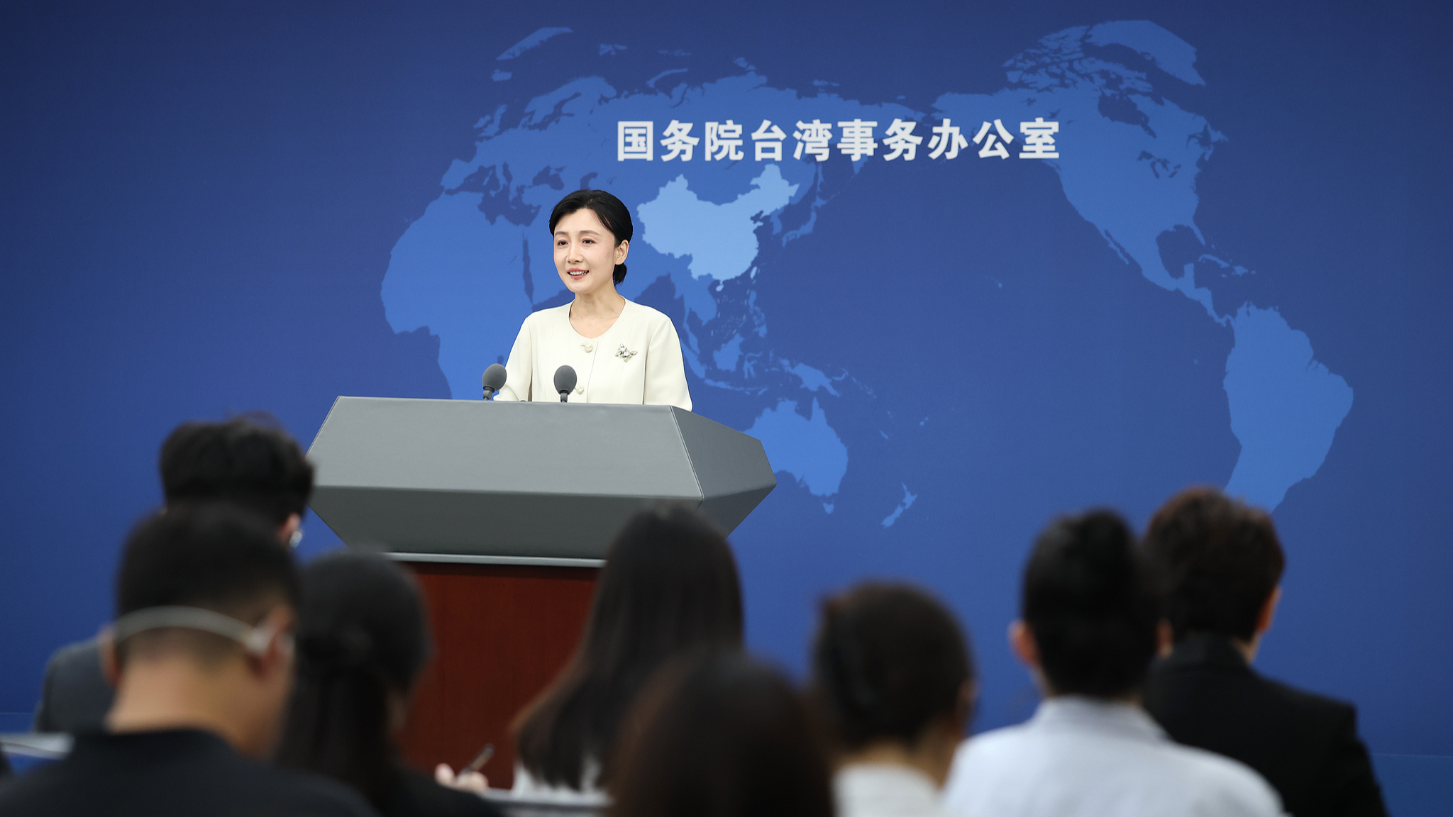 Zhang Han, spokesperson for the State Council Taiwan Affairs Office, holds a press conference in Beijing, August 26, 2026. /VCG